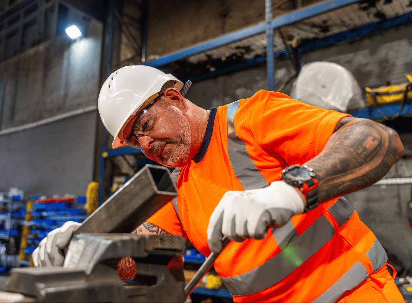Man in PPE using tools.