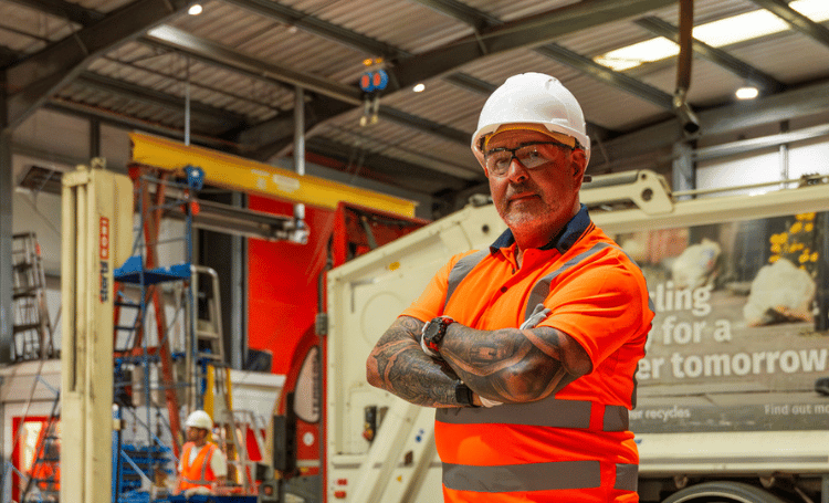 Man wearing hi-vis in a warehouse.