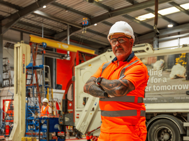 Man wearing hi-vis in a warehouse.